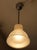 This pendant light was manufactured by Holophane. It is made of polished aluminium and structured glass and has been...