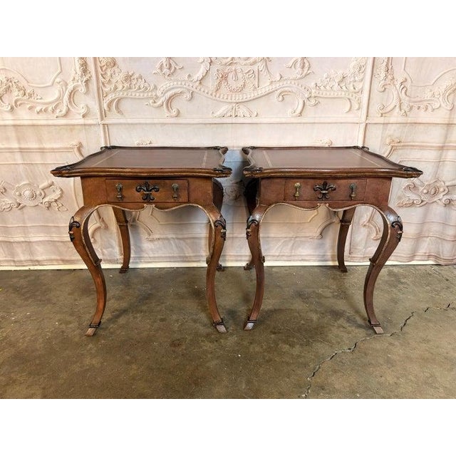An utterly charming pair of French Louis XV-style side tables, a masterful trompe-l'œil creation celebrating the art of...