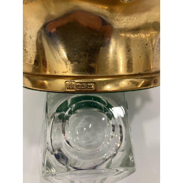 This wine coaster is gold plated The outer edge features garlands of grapes and grape leaves The condition is excellent