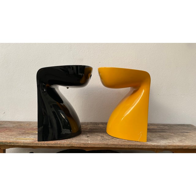 Make a bold statement with this designer pair of Bowl Chairs—one in sleek black and the other in vibrant yellow, combining...
