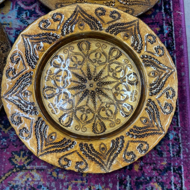 Set of six vintage ceramic chargers measuring a little over 13” in diameter. Amber brown in color overall but the light...
