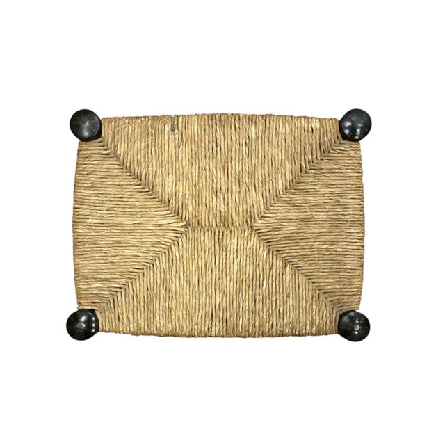 A charming, antique stool. Features spool leg detailing with an ebonized finish and gilt Hitchcock style stenciling to the...