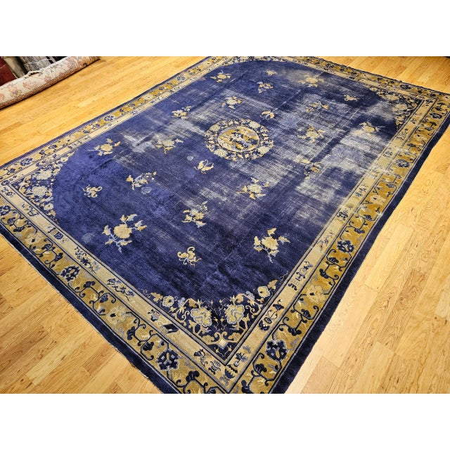 Imbued with history and cultural meaning, this 19th Century Chinese Peking rug is a masterful expression of traditional...