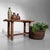 A small Japanese wooden table with a powerful, simple silhouette, richly grained wood and a beautifully aged patina....