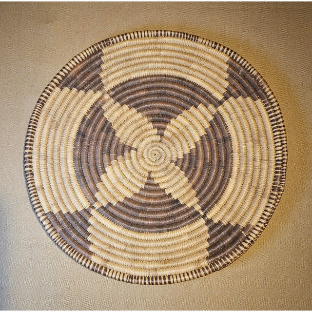 This vintage Native American handwoven coiled basket is a beautiful example of Southwestern craftsmanship, created in the...