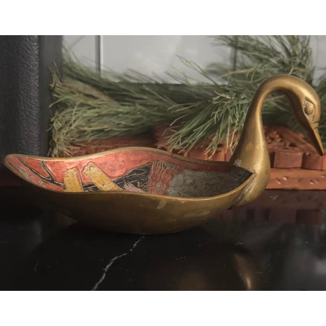 Mid-century sculptural brass swan bowl with hand-textured enamel interior and solid, well-balanced weight.