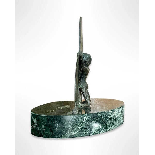 A wonderful vintage sculpture made of bronze mounted on a base of green polished marble. This decorative sculpture depicts...