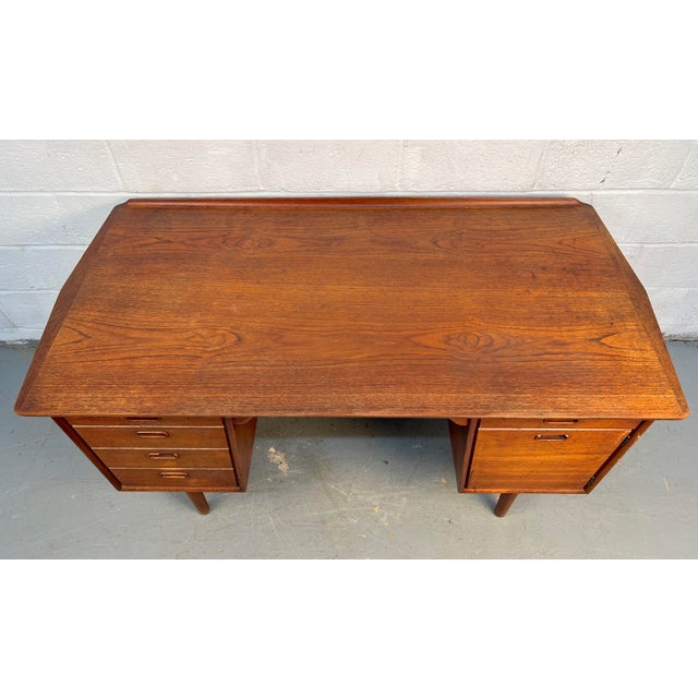 Elegant mid-century modern Danish desk crafted from beautifully grained walnut. Features clean Scandinavian lines,...