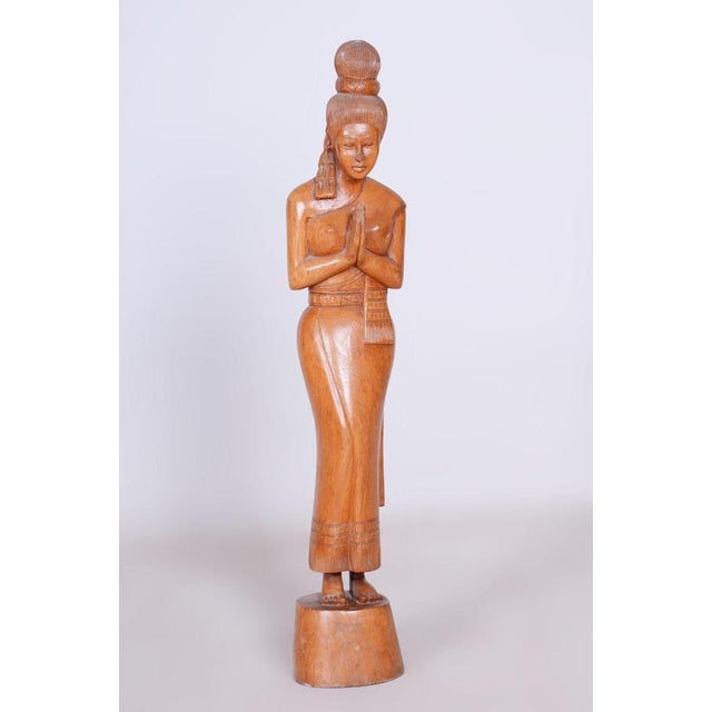 This elegant sculpture dates back to the mid-20th century and is an example of traditional Asian wood carving that carries...