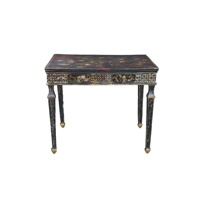 Vintage Chinoiserie / Regency-style black lacquered partners writing desk / library table / console featuring ornate...