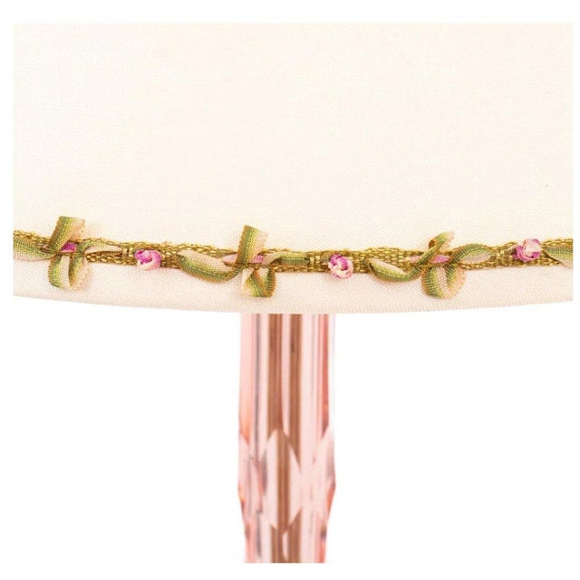 A lovely, feminine pair of cut crystal table lamps in a soft shade of pink with slender columns that flare at the base to...