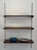Vintage 1960s Mid-Century Modern wall shelving system in style of Kai Kristiansen, featuring richly grained rosewood...