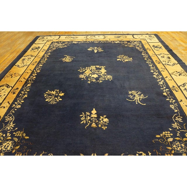 Blue Antique Rectangle 1920s Wool Hand Knotted Pile Rug, Circa Date: 1920s. This exceptional example of a 1920s textile...