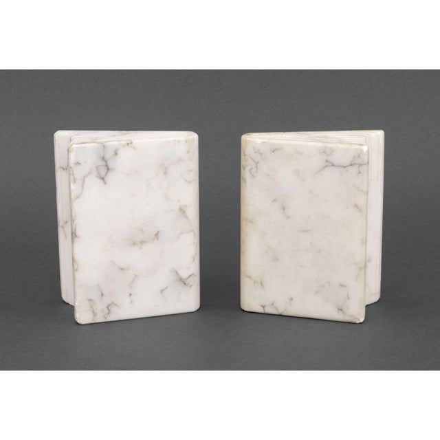 Pair of Modern White Marble Book Form Bookends. 5.25" H x 4.25" W x 2.25" D. Provenance: A Brooklyn Heights, New York Estate.