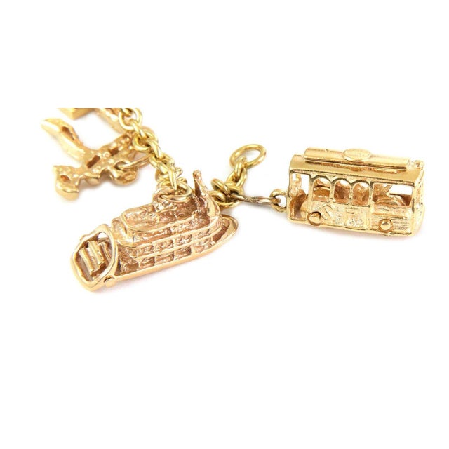 This beautiful landmark and travel theme bracelet is crafted from 18k yellow gold featuring 12 14k charms in 3D depicting...