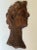 Hand carved dark walnut figure of a man's head, profile. Classic features and patina. This must have been salvaged from...