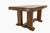 A French-style dining table dating from around 1940, crafted from oak. It is distinguished by its sturdy construction and...