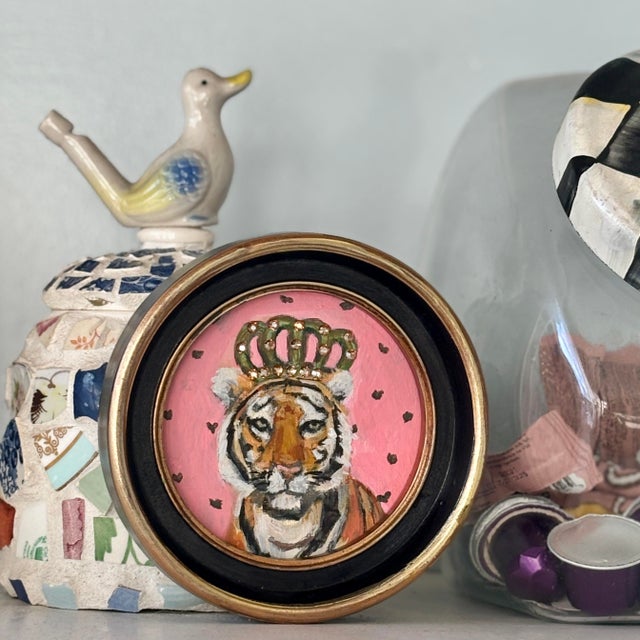 Small whimsical round painting of a bengal tiger with a jeweled Crown by Michelle Heimann. The 4”x4” painting arrives...