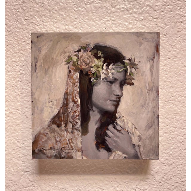 This oil painting presents a serene portrait of a woman adorned with a floral crown, her expression contemplative and...