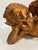 A beautifully reclining cherub finished in a rich antique gold tone. Likely crafted from plaster or chalkware, this...