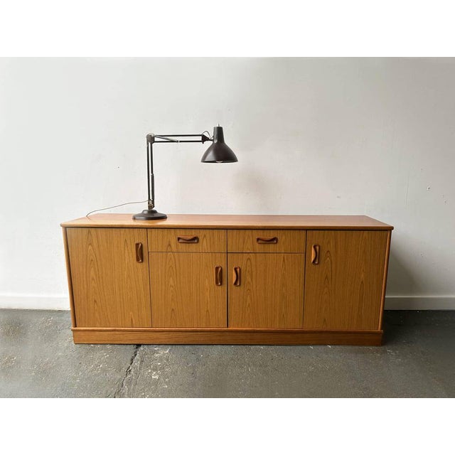 A danish influenced g plan long sideboard produced in the 1970s …also ideal as a tv stand or media unit. The top drawer is...