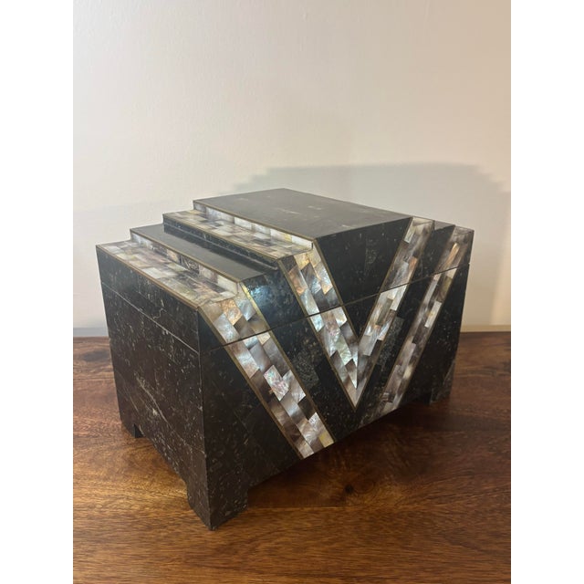 A striking vintage postmodern decorative box showcasing the luxurious craftsmanship associated with late 20th century...
