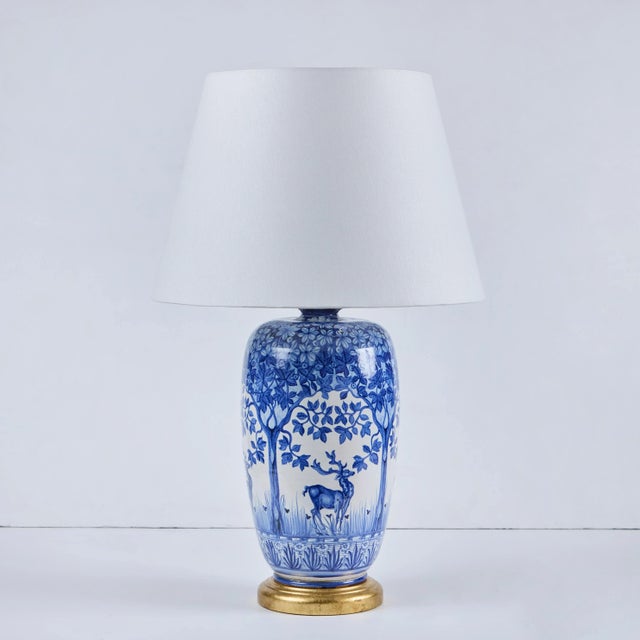 Pair of French, hand-painted porcelain vases, circa 1920’s made into lamps at a later date. Gilt-wood bases, new linen...