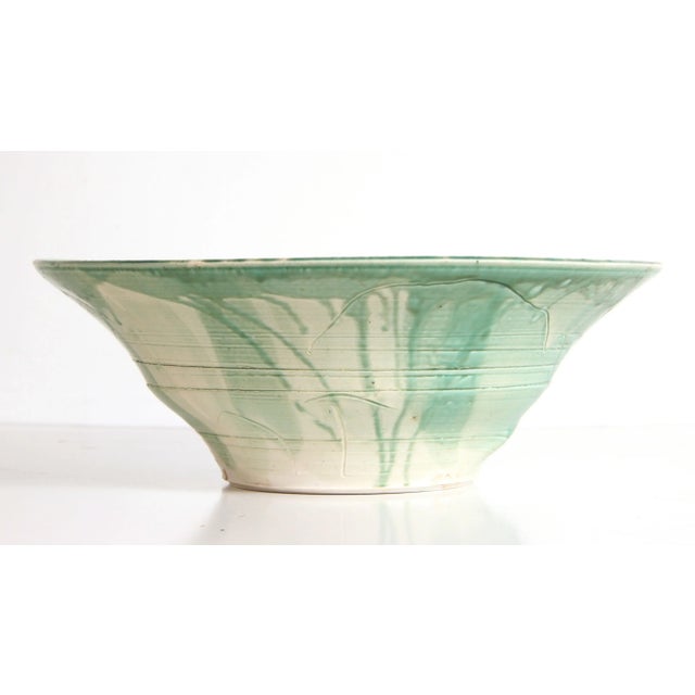 This substantial wheel-thrown bowl is a strong example of the form, with a wide flaring profile, visible throwing rings,...