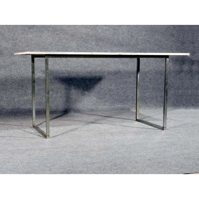 Vintage modern marble top coffee table with polished chrome base. WEAR Wear consistent with age and use. Minor fading....