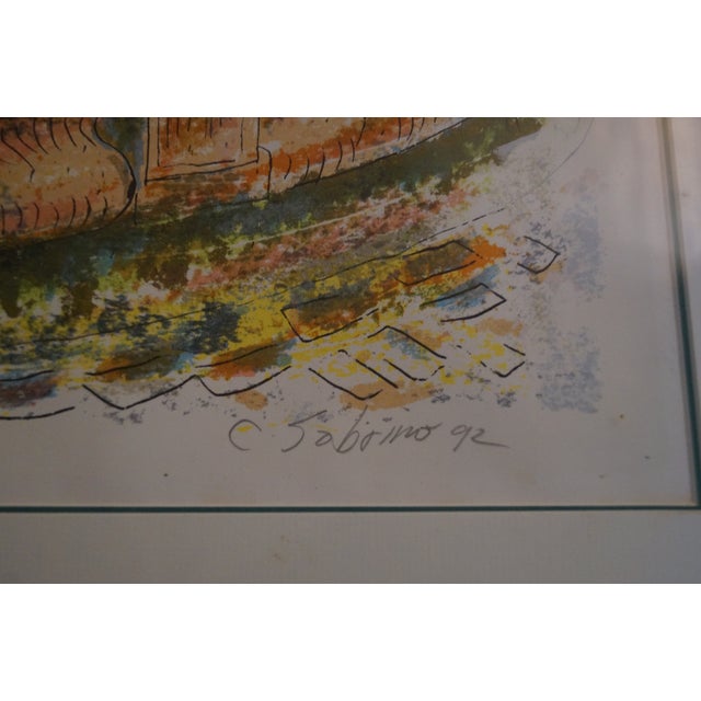A framed signed and numbered serigraph from Puerto Rican artist Carmelo Sobrino. This piece depicts the Versailles...