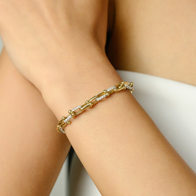 Elevate your jewelry collection with this 14 Karat Yellow Gold Diamond Paperclip Link Bracelet, meticulously crafted in a...
