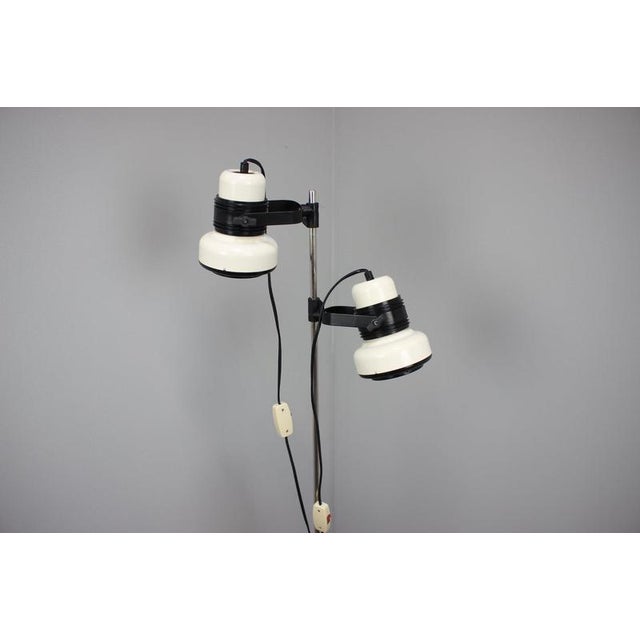 Striking vintage hungarian floor lamp from the 1970s in a distinctive space age aesthetic, featuring two individually...