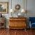 This vintage French Provincial style bombe chest by Ferguson Copeland features a serpentine wood frame topped with a...
