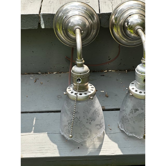 Old Lights On is pleased to offer this set of three nickel Bradley & Hubbard wall sconces with vintage stencil etched...