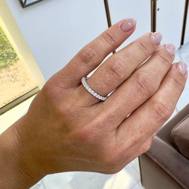 Gender: Ladies Metal Type: 18K White Gold Ring Size: 6.5 Width: 2.05 mm Weight: 2.10 grams Lady's rhodium-plated 18K white...