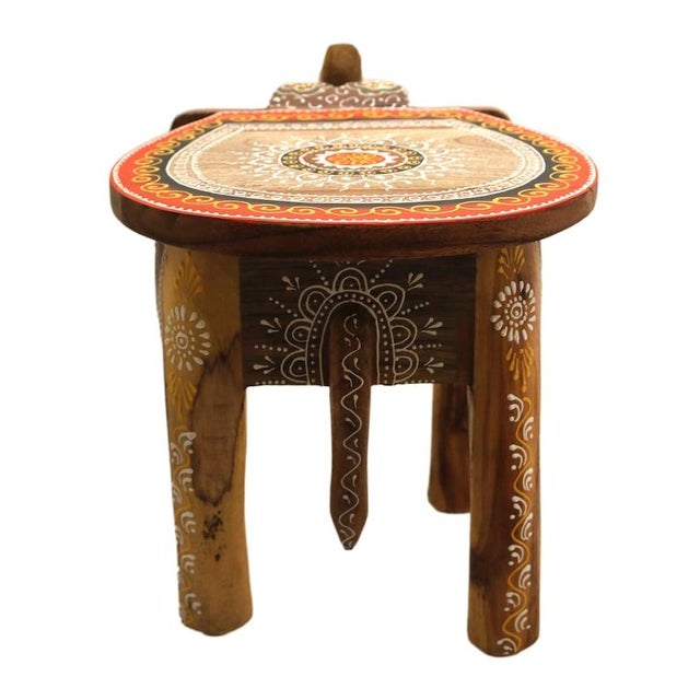 Width: 28 centimeters Height: 30 centimeters Depth: 40 centimeters This handmade solid wood stool made of mango wood is...