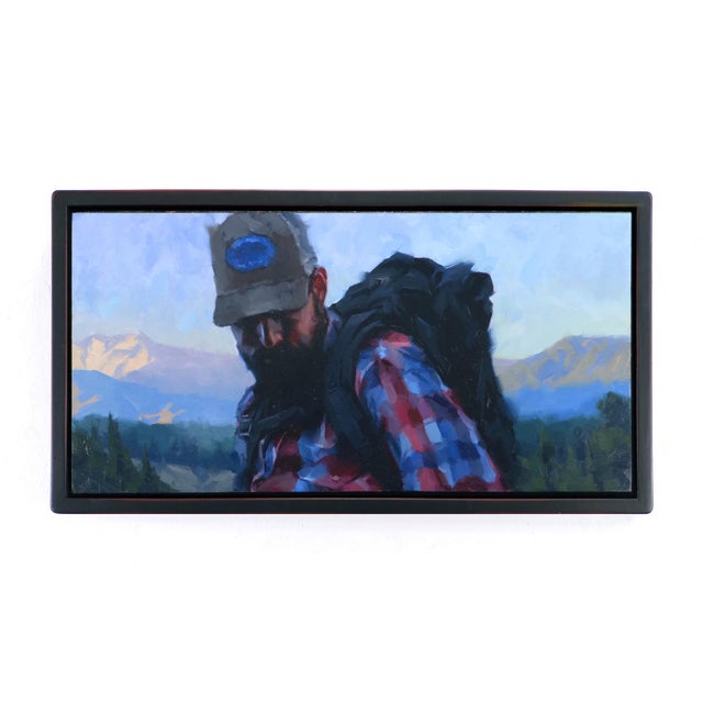 In "Heading Down," a solitary figure dons a plaid shirt and a cap, exuding a sense of rugged determination against a...
