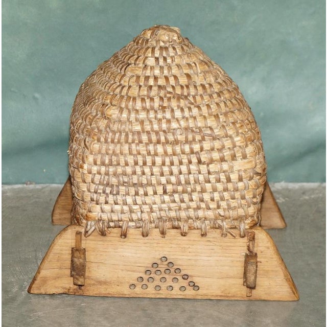 19th Century English Folk Art Woven Bee Skep in Primitive Wooden Stand A wonderfully characterful 19th century English bee...