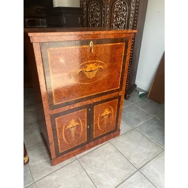 Very nice antique walnut drinks bar with satin wood marquetry inlay. Pull down flap with leather inset, 2 doors below for...