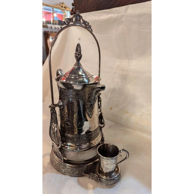 Victorian quadruple silverplate ice water tipper, for the owner of the manor. Made to serve ice water by tipping the...