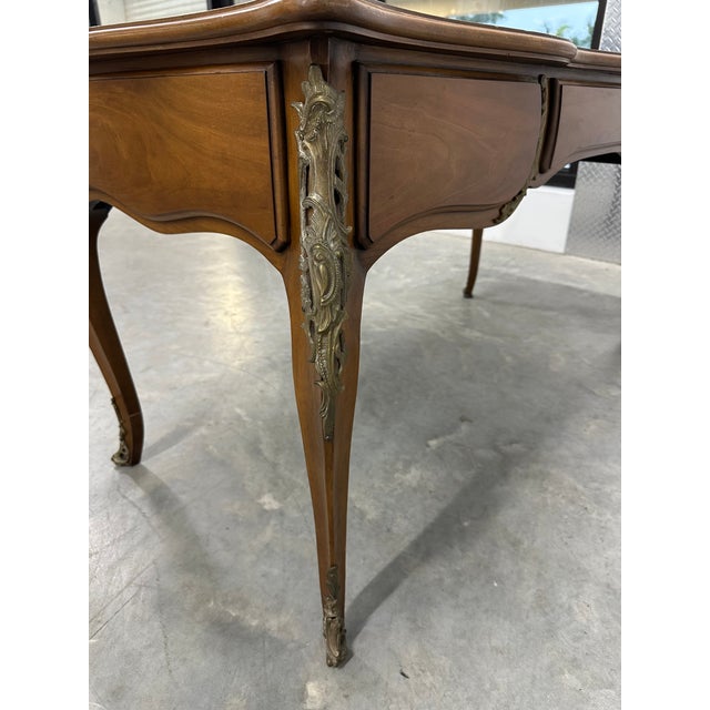 An exceptional French Louis XV style bureau plat writing desk handcrafted by the renowned Karges Furniture company of...