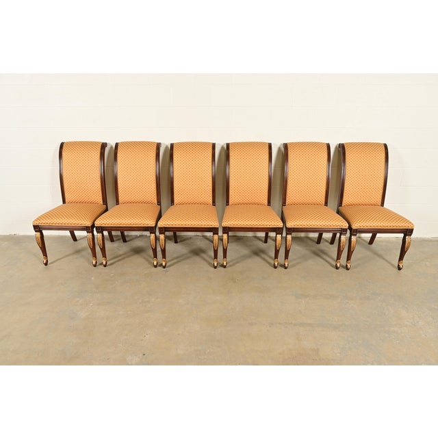 A gorgeous set of six Regency, Neoclassical, or Empire style dining chairs In the manner of Baker Furniture USA, Circa...
