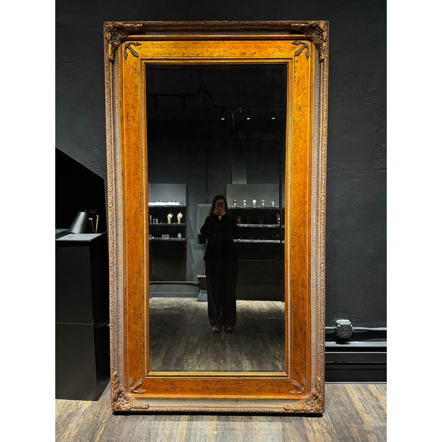 This is a vintage Louis XVI-style ornate copper-gilt framed mirror with acanthus leaf and foliate motif. Please note that...