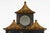 A wonderfully distinctive Chinoiserie ebonized gilded two-tiered mirror with a smaller mirror housed inside a gilded...