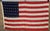 An authentic vintage 48-star United States flag measuring approximately 46.25 inches by 74 inches, representing one of the...