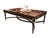 Make a striking statement with this luxurious Regency-inspired coffee table, featuring a richly figured brown wood top...