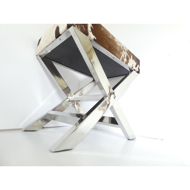 Vintage French Cowhide & Stainless Steel Footstool attributed to 23homedesign, in Very Good conditions. Designed 1980 to 1989