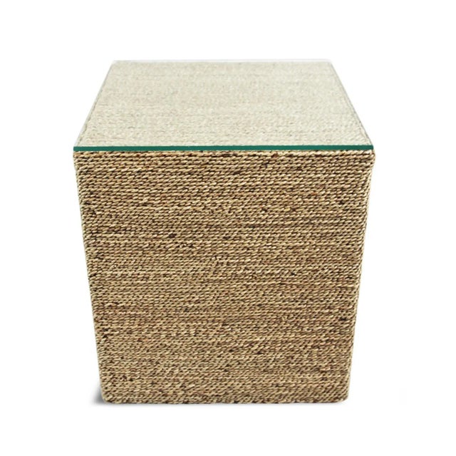 Square cube hand woven seagrass side table. Wood frame with seagrass masterfully woven around sides and top. Includes...
