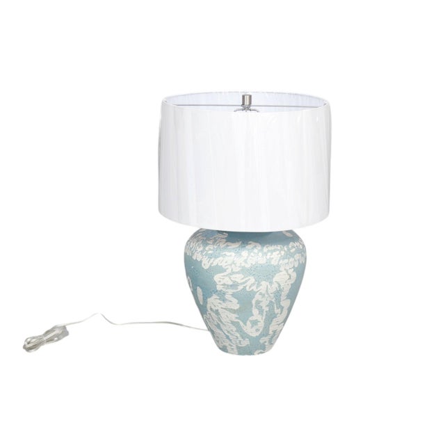 A ceramic Mimi table lamp in Aqua by Currey and Company. The ginger jar shaped vase is decorated with sgraffito in an...