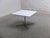 Early side or coffee table designed by Arne Jacobsen in 1968. This example features a square white laminated top with an...